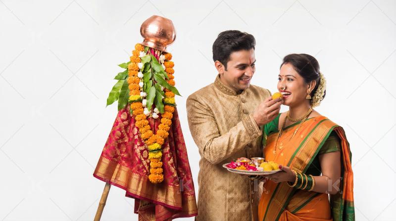 Happy Indian Couple Celebrates Gudi Padwa with Traditional Sweet