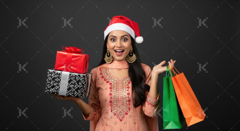 A joyful woman celebrates holidays, shopping, and festive gifts.