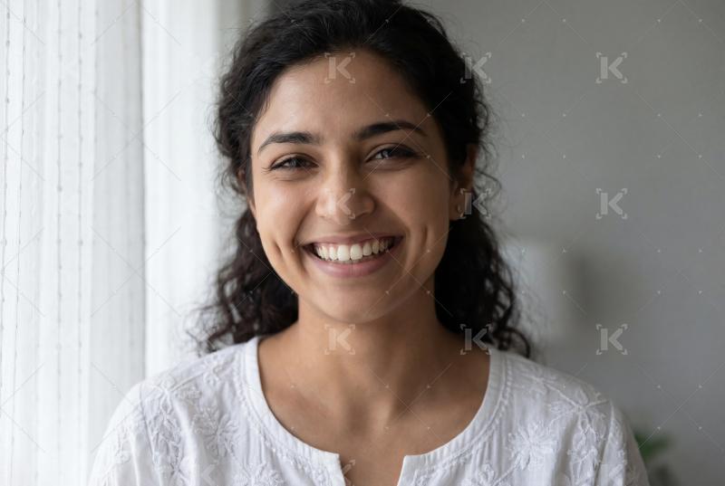 Close up of young indian woman smiling