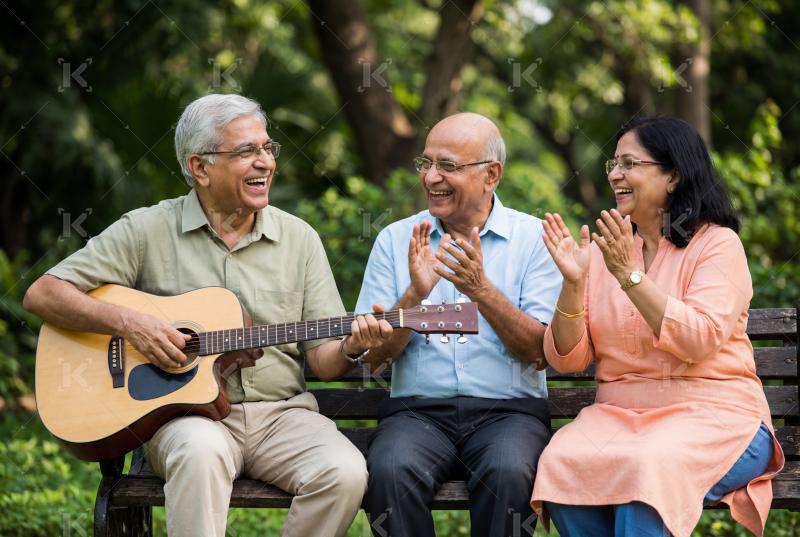 Happy indian middle aged people enjoying together at park