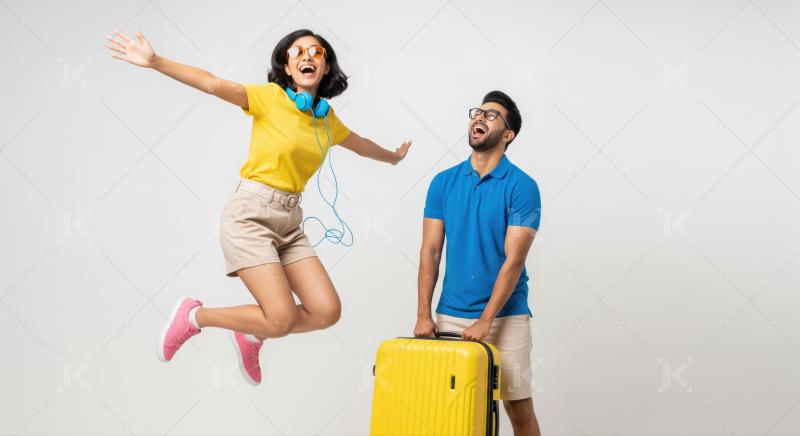 Excited Indian Couple Jumps, Ready for Summer Travel Vacation