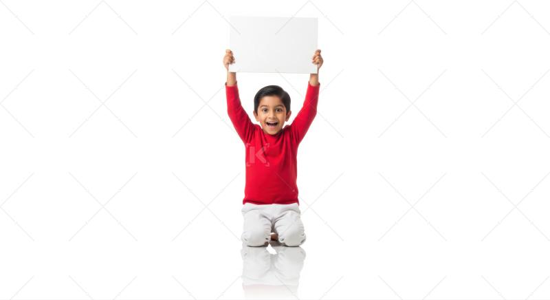 Happy Indian boy holds blank white sign, ready for message.