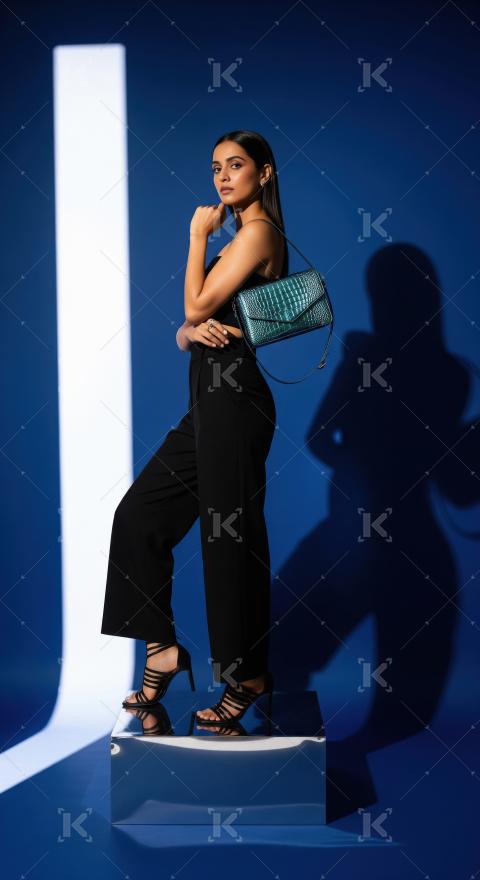 Young indian woman wearing fashionable cloths posing on isolated