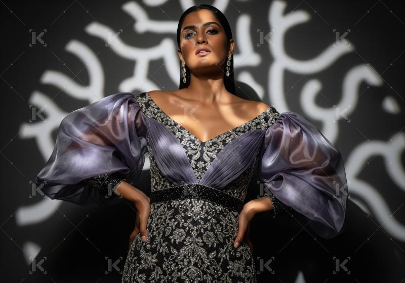 Young indian woman wearing fashionable cloths posing on isolated