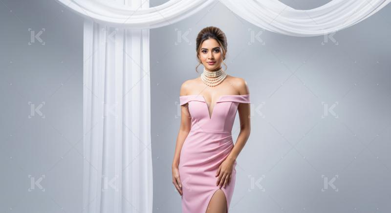 Beautiful Woman in Glamorous Pink Gown with Pearl Necklace