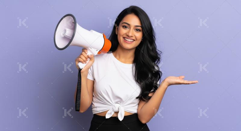 Young beautiful indian woman using megaphone