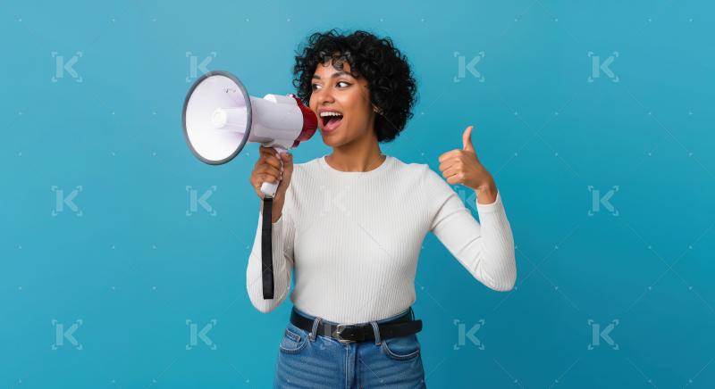 Young indian woman holding megaphone