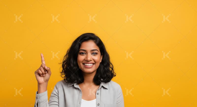 Young beautiful indian woman pointing finger on empty space