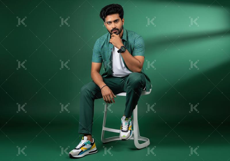 Stylish Young Man Posing Confidently in Modern Casual Attire