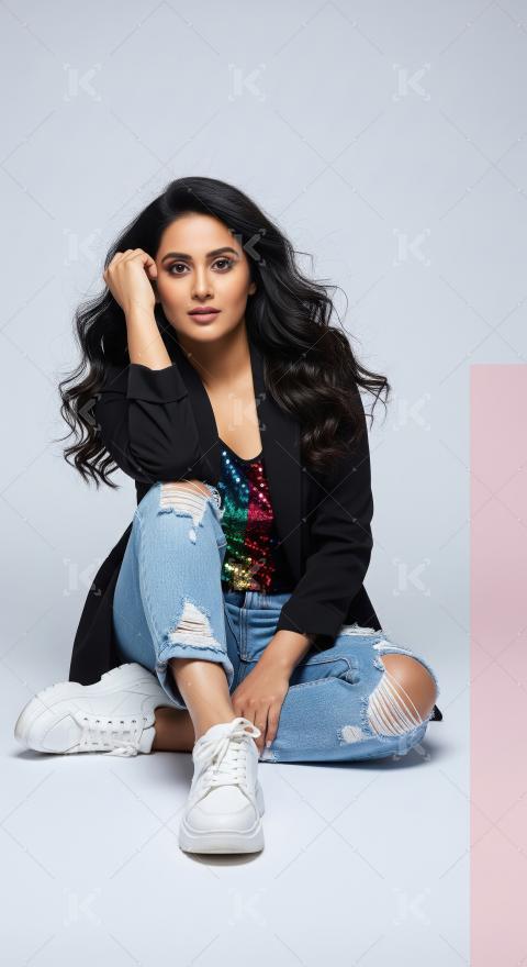 Trendy Woman Posing Confidently in Ripped Jeans and Sequin Top