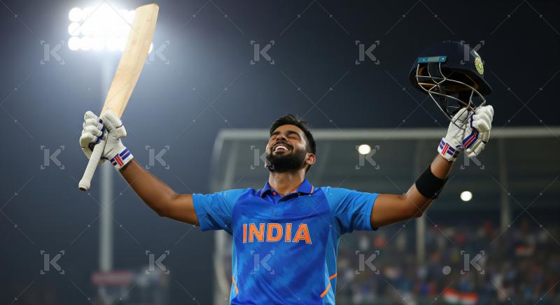 Joyful Indian Cricketer Celebrates Victory Holding Bat and Helme