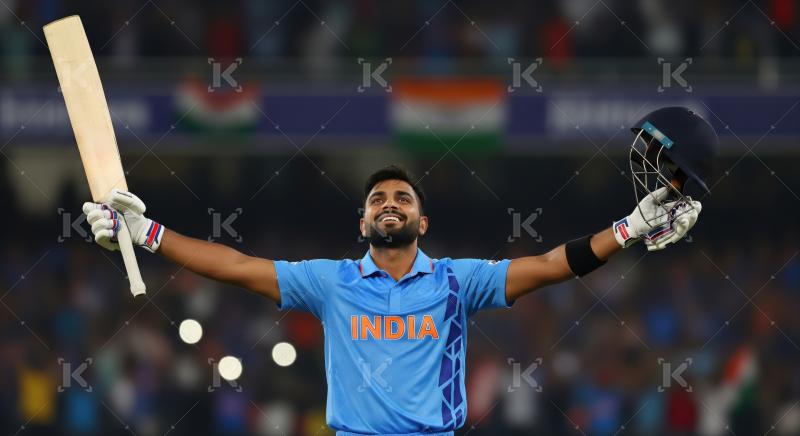 Indian Cricketer Celebrates Triumphant Moment with Bat and Helme