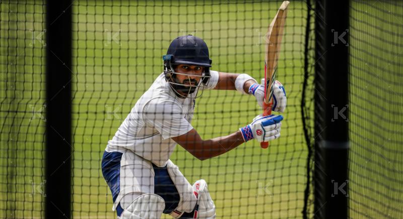Indian Cricketer Practicing Batting in Training Nets