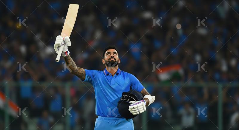 Indian Cricketer Celebrates Milestone with Bat and Helmet