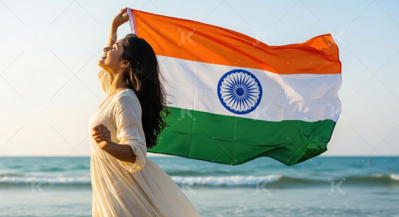 Happy woman holding Indian flag proudly at beautiful beach sunse