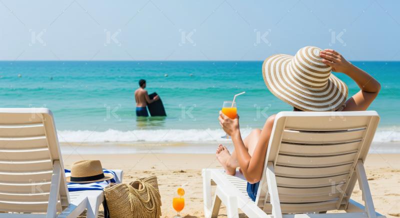 Sunny beach scene: relaxing woman and man with boogie board.