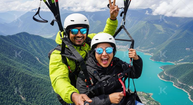 Happy couple enjoying thrilling paragliding adventure over a beautiful lake.