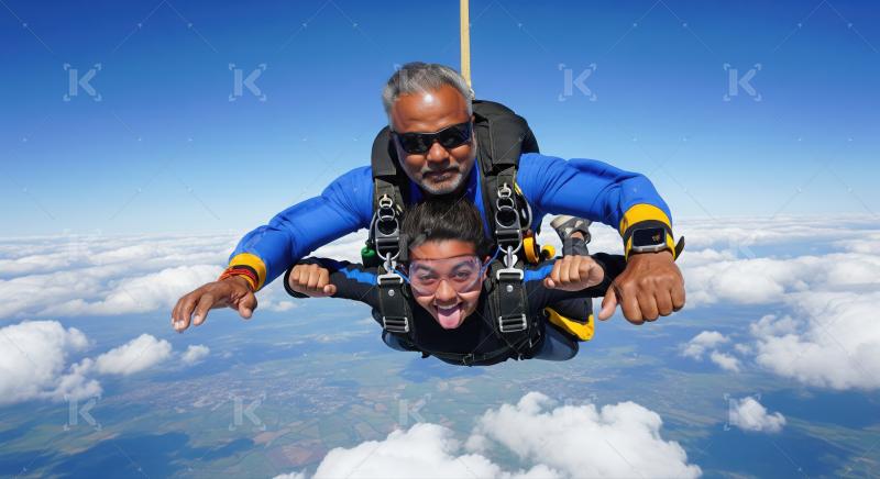 Excited skydivers freefalling through a clear, blue, beautiful sky.