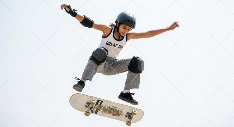 Young Skateboarder in Mid-Air Performing a Dynamic Trick