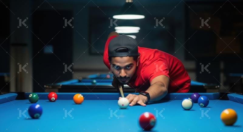 Man playing pool, aiming cue ball on blue table