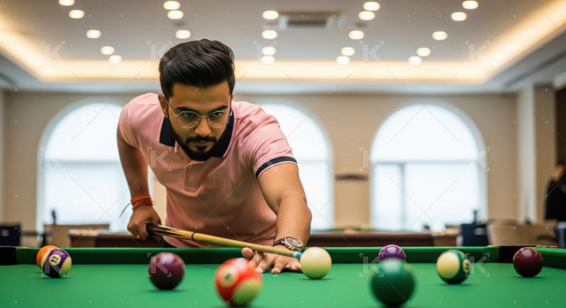 Young Man Playing Billiards, Focused on His Next Shot