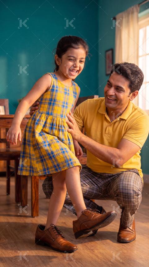 Happy indian father and daughter enjoying together at home