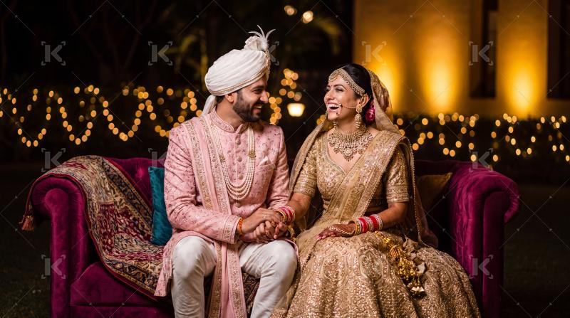 Happy indian groom and bride enjoying together at home