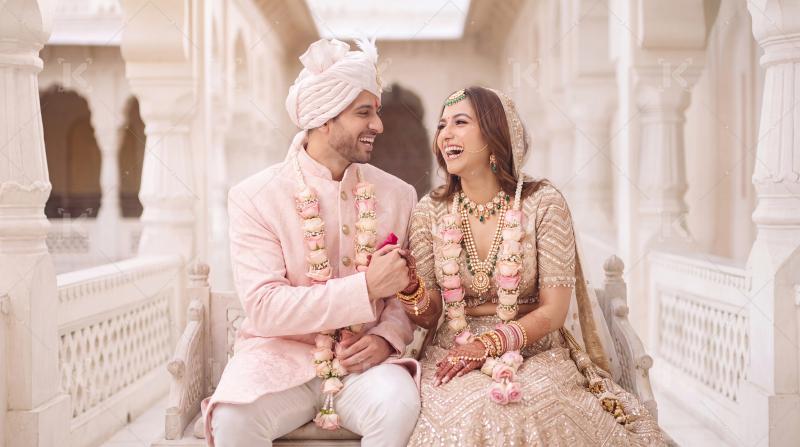 Happy indian groom and bride enjoying together at home