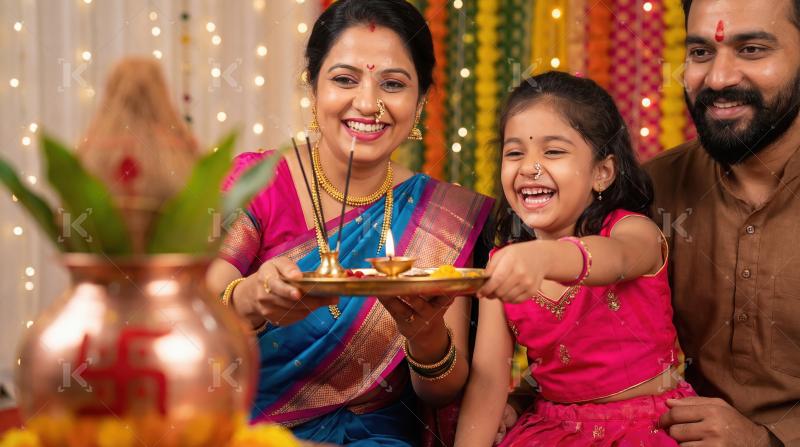 Happy Indian Family Performing Traditional Puja during Festival