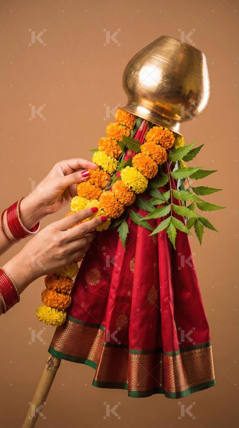 Woman Decorating Traditional Gudi for Gudi Padwa Festival