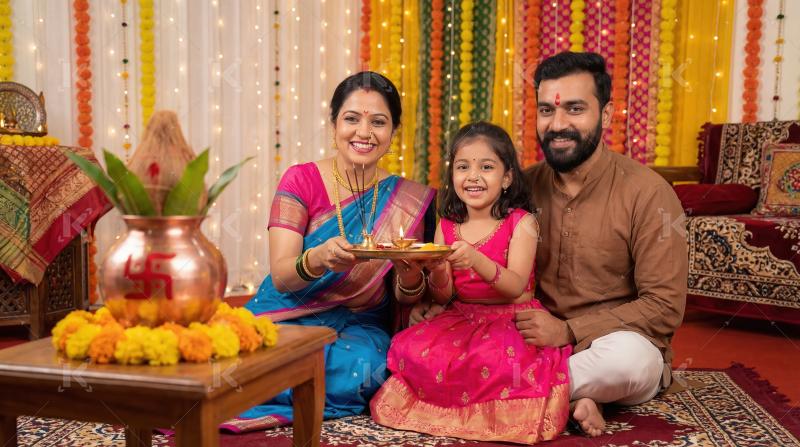 Happy Indian Family Celebrating Traditional Festival with Puja