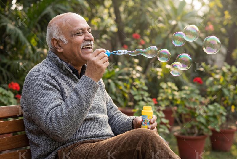 Happy indian senior man enjoying at park
