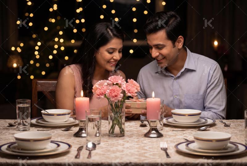 Young indian couple enjoying dinner together