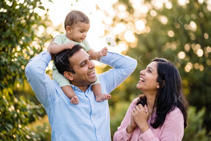 Happy indian family enjoying together at park