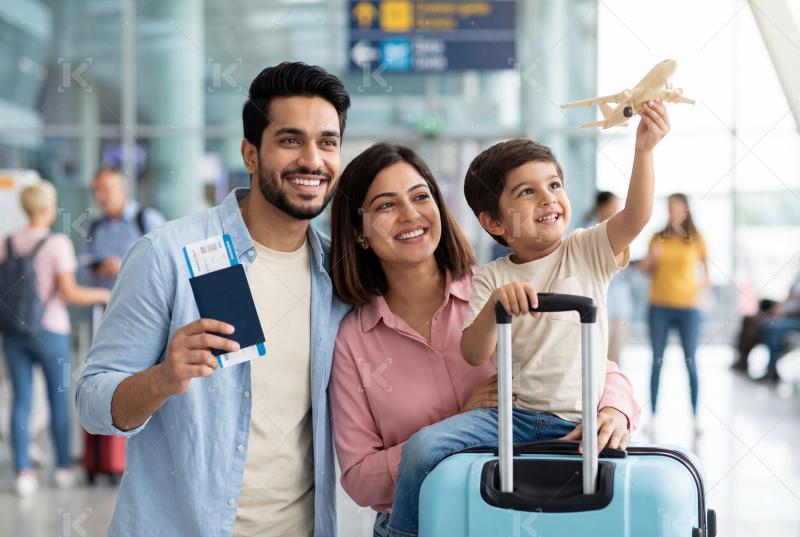 Happy indian family walking with travelling bag