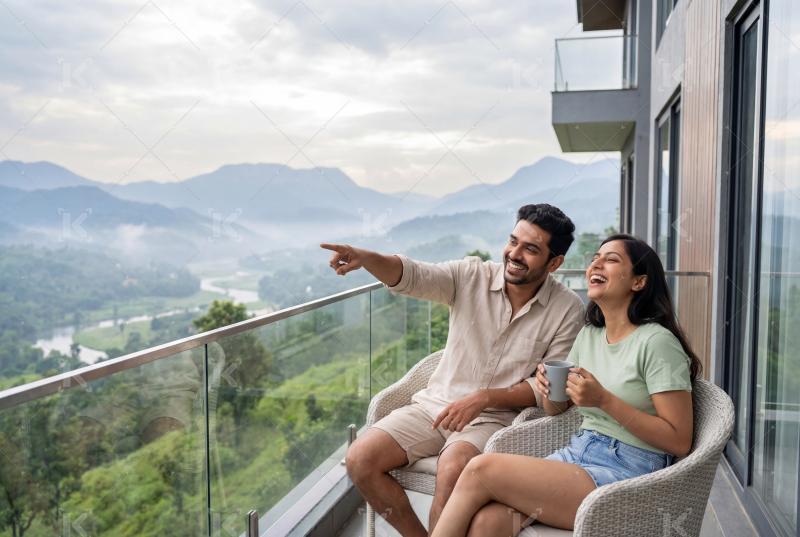 Young indian couple enjoying together at balcony