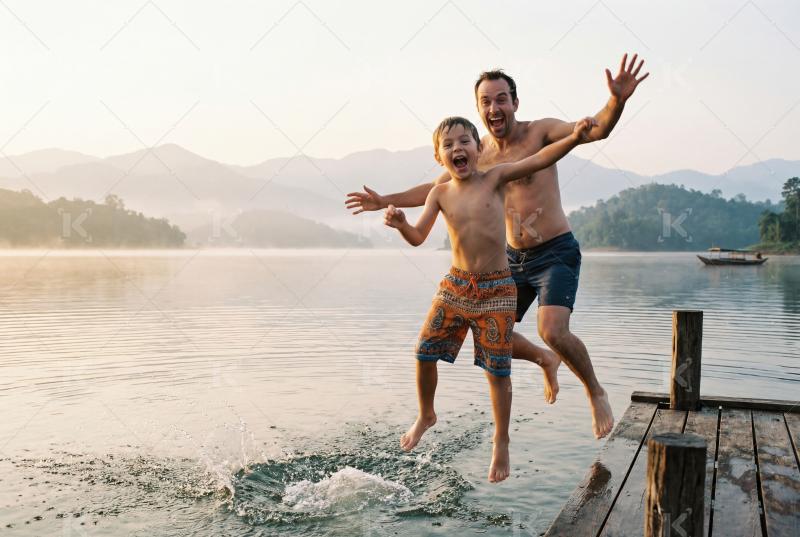 Happy indian family enjoying on sea beach