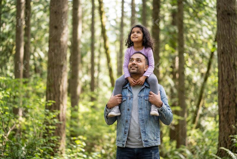 Happy indian father and daughter enjoying together at park