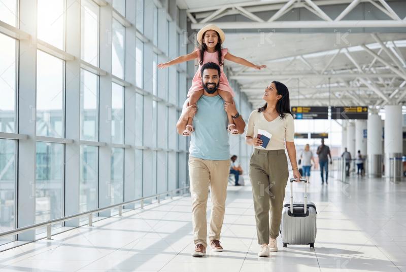 Happy indian family walking with travelling bag