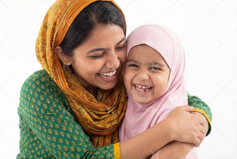 Happy indian muslim woman hug to her daughter