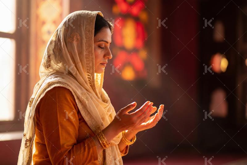 Indian muslim woman praying at home on Ramadan festival
