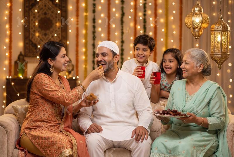 Happy indian muslim religious family celebrating Eid festival to