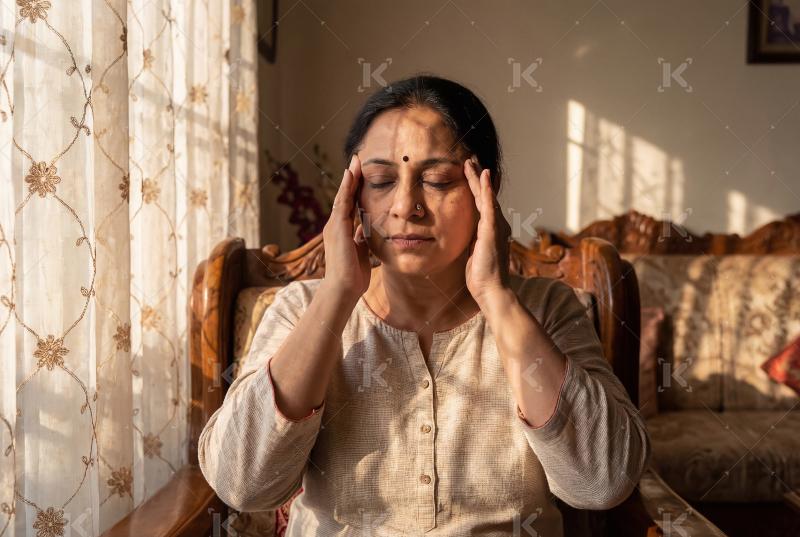 Young indian woman suffering from head pain