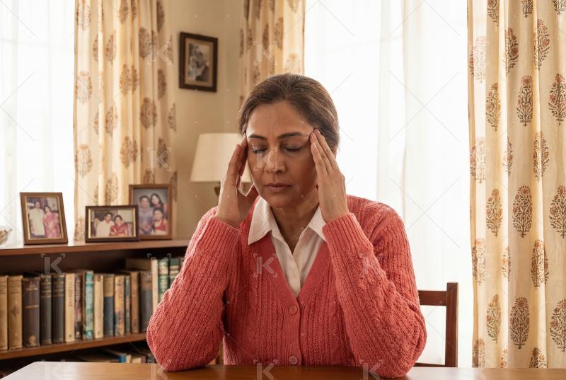 Young indian woman suffering from head pain