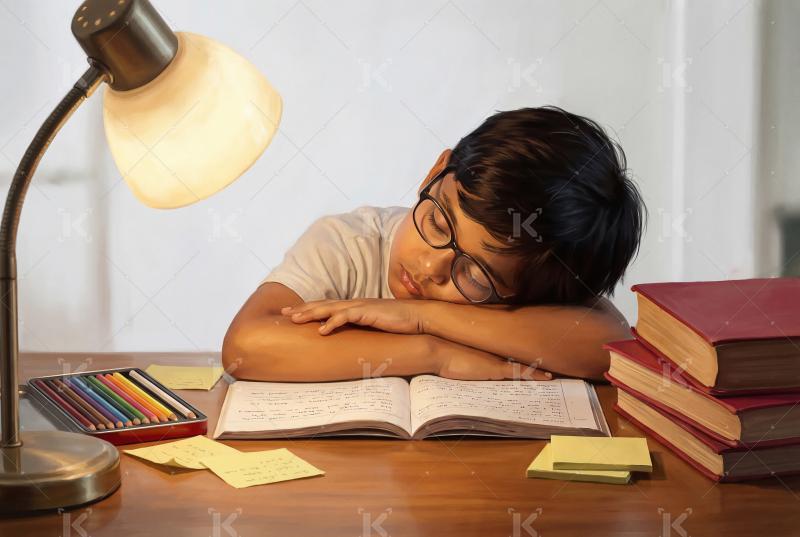 Happy indian school boy doing study at home
