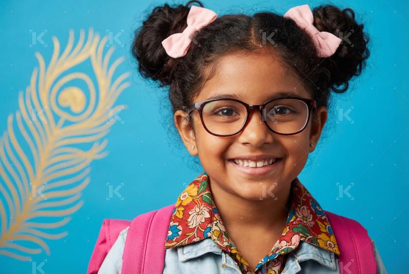 Happy indian school children going to school