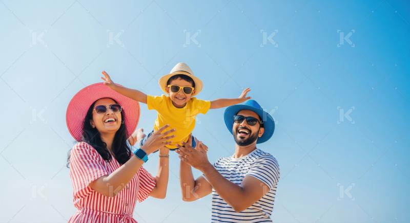Happy Indian Family Playing Outdoors Under Sunny Blue Sky