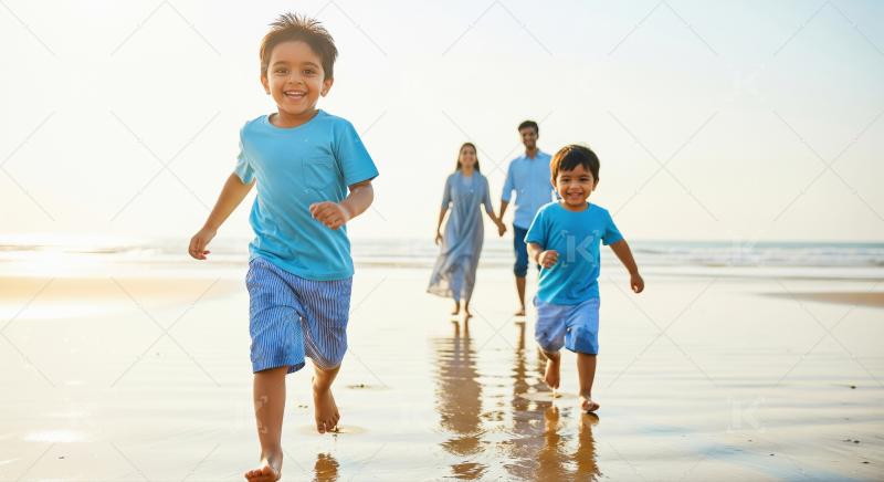 Happy Indian Family Running on Beach at Sunset