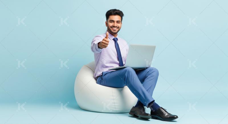 Happy Businessman Working on Laptop Giving Thumbs Up