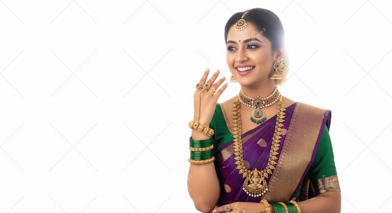 Smiling South Indian woman wearing traditional saree and antique